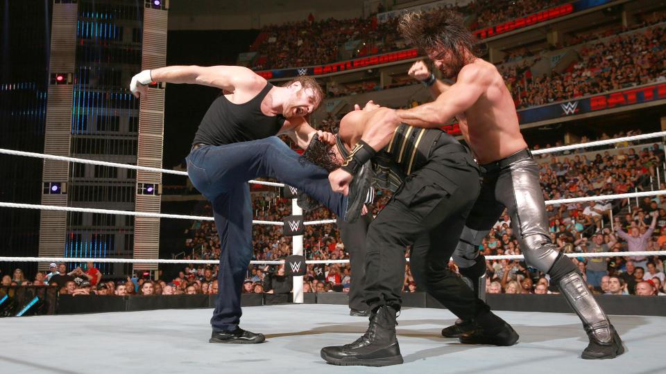 Dean Ambrose and Seth Rollins attacking Reign