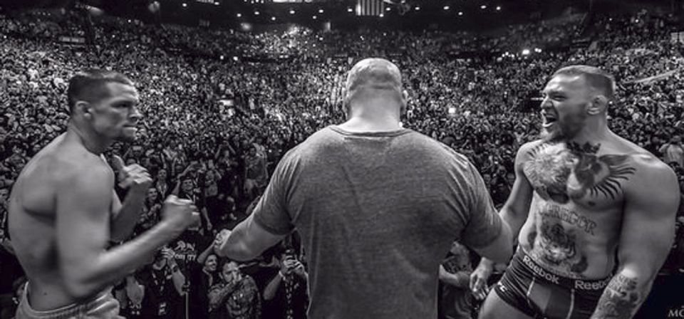  Nate Diaz and Conor McGregor face off at the UFC 196 weigh-ins at the MGM Grand