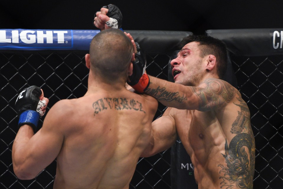  Hammer blow: Eddie Alvarez lands a huge uppercut on Rafael dos Anjos en route to winning the UFC lightweight title in July