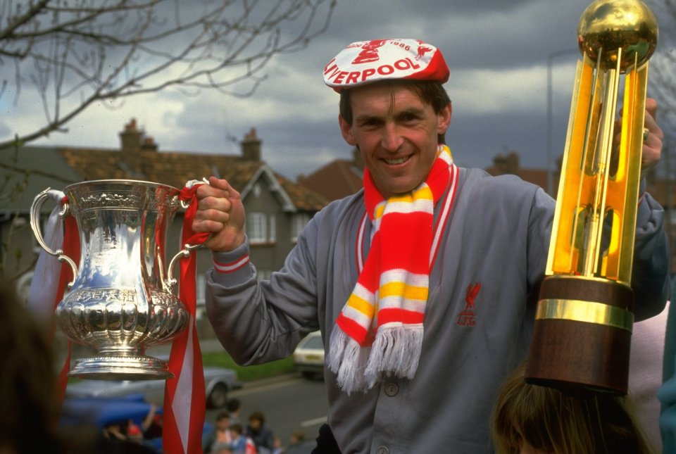 1986: Player/Manager Kenny Dalglish of Liverpool poses with the FA Cup and the Canon League Division One trophy during their homecoming after the FA Cup final against Everton at Wembley Stadium in London. Liverpool won the match 3-1 to gain a League andCup double. Mandatory Credit: Allsport UK /Allsport