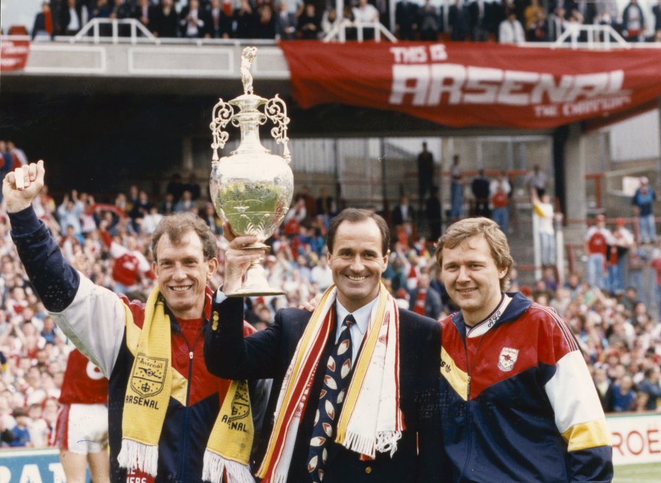 11.05.1991. Arsenal football club mamager George Graham, centre, holds up the cup inside the stadium. With him are Stewart Houston and Gary Lewin (Physio). Retrocon Sport Football