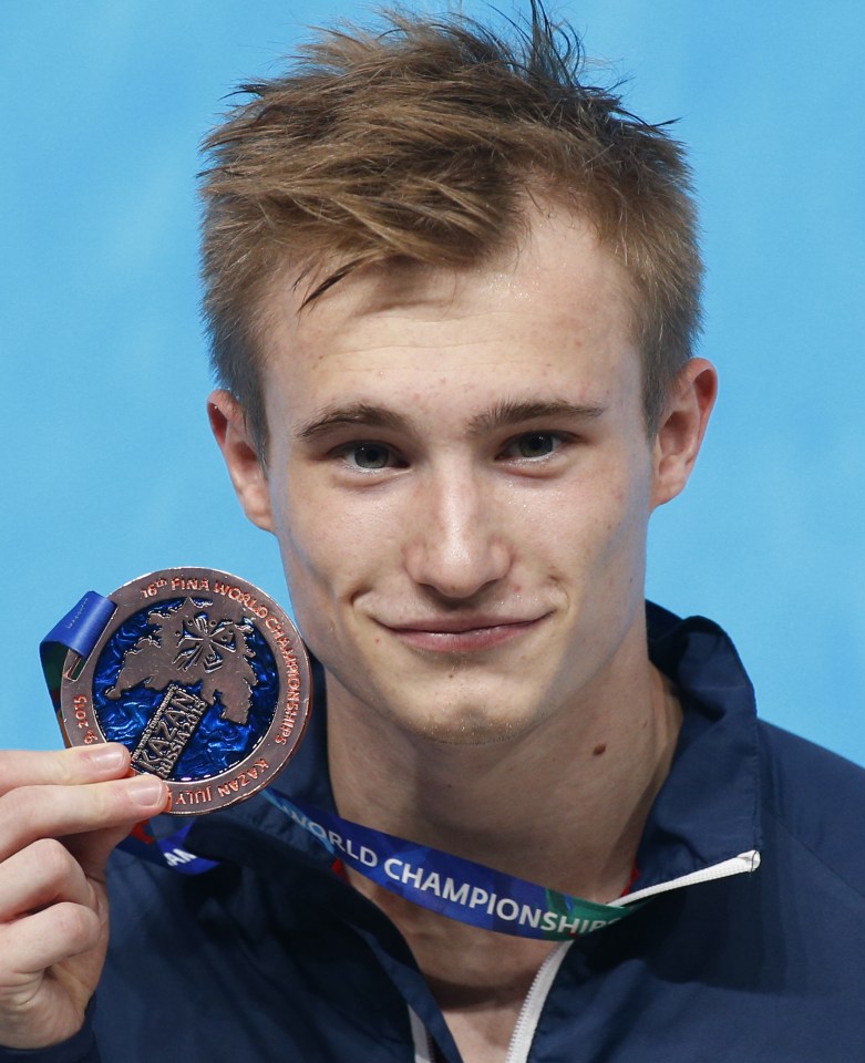  Laugher shows off his bronze medal from the Swimming World Championships