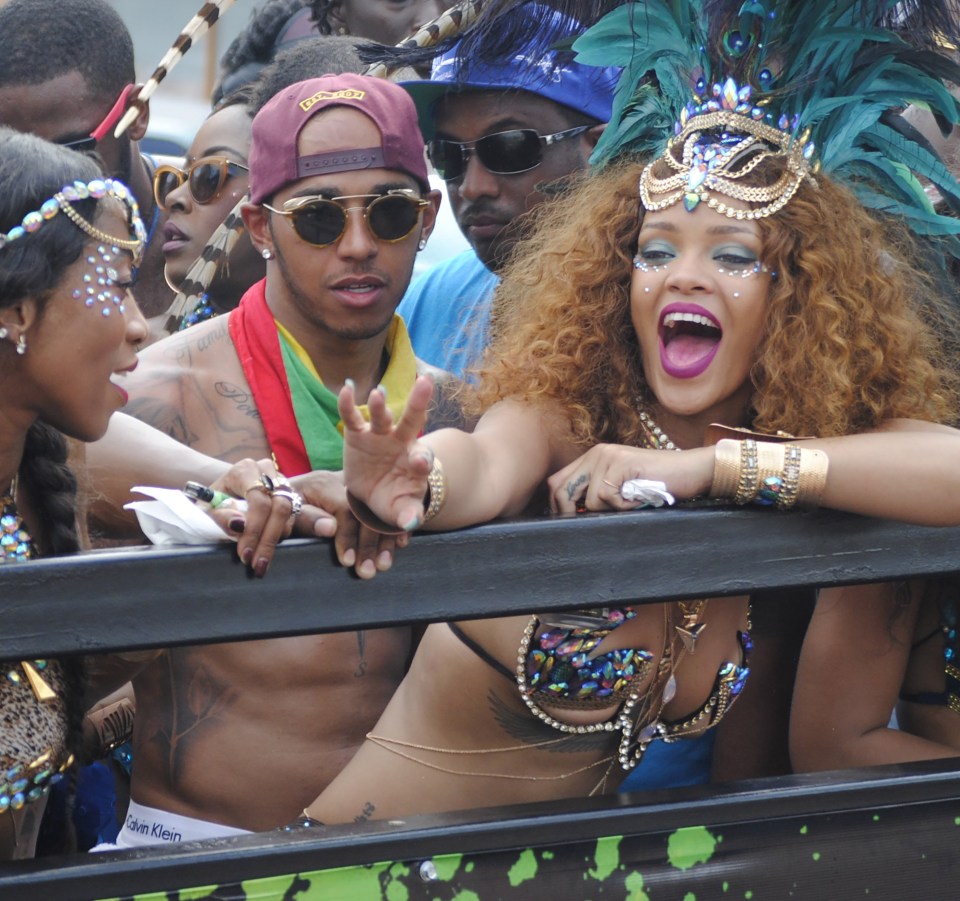 Rihanna and Lewis Hamilton are pictured partying during Barbados' Kadooment Day Parade