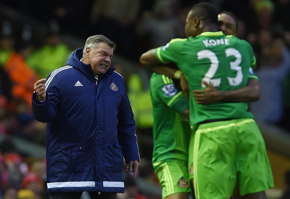 Allardyce celebrates as Defoe is mobbed by his Sunderland teammates after scoring the equaliser in the 2-2 draw at Liverpool