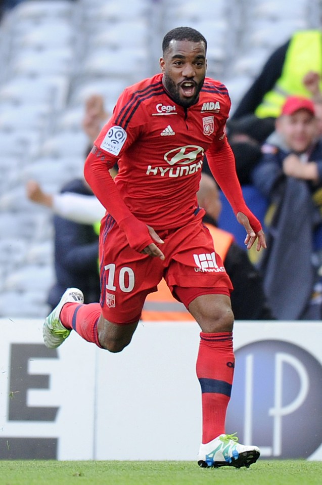 Lyon's French forward Alexandre Lacazette celebrates after scoring during the French L1 football match Toulouse against Lyon on April 23, 2016 at the Municipal Stadium in Toulouse southern France. AFP PHOTO / REMY GABALDAREMY GABALDA/AFP/Getty Images