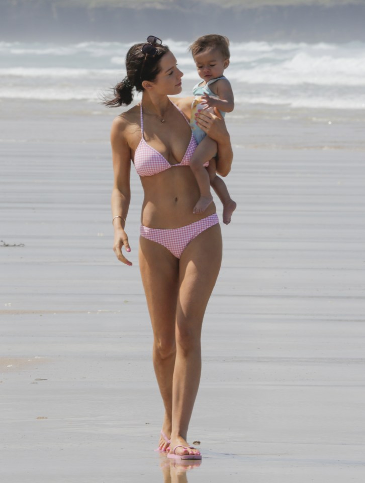  Great to 'sea' her back... Helen strolling on the beach with daughter, Matilda