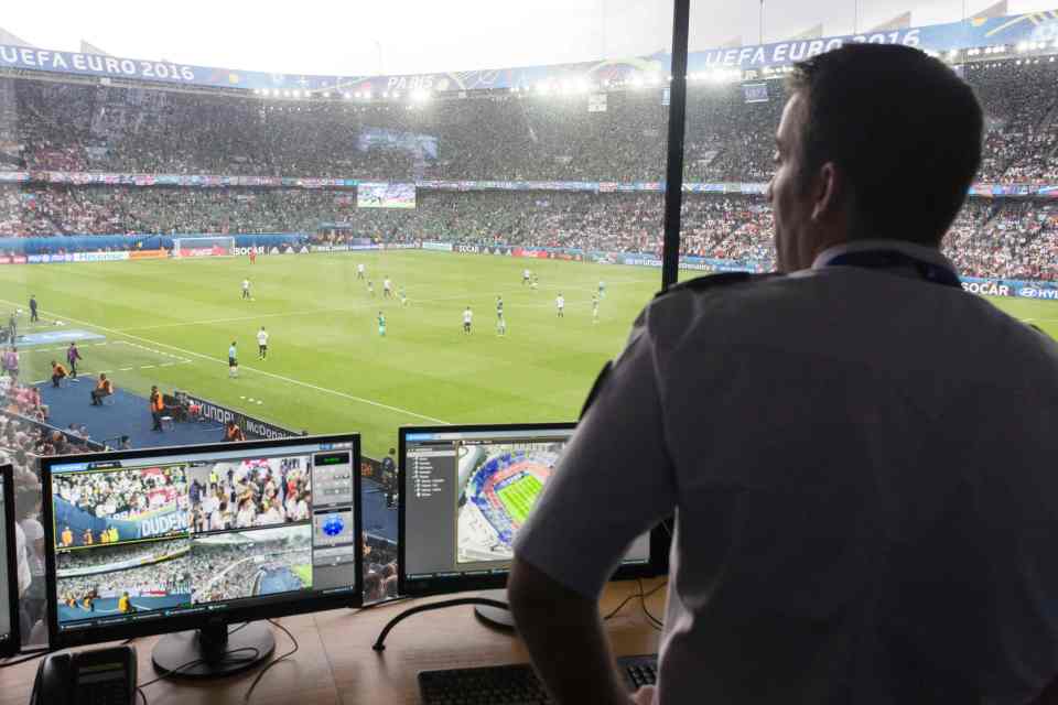  A French police officer watches surveillance screens in the control centre