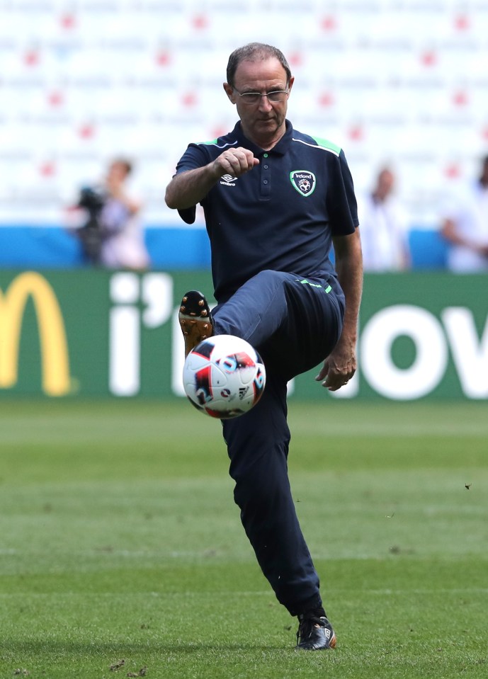  Martin O'Neill takes a shot with a football during Ireland's warm-up for their Euro 2016 showdown with France