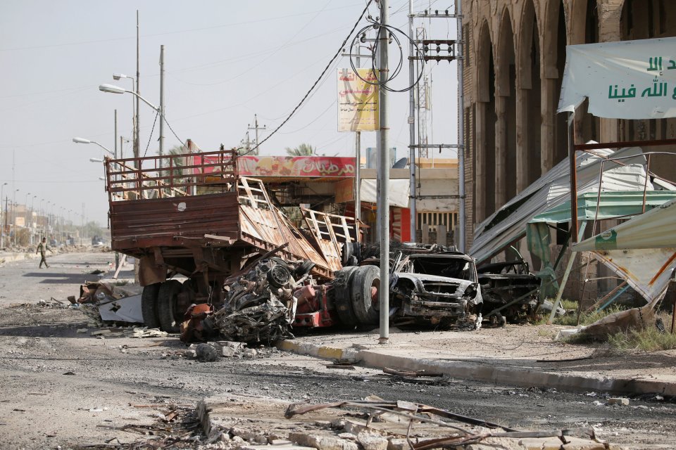  Newly-liberated Fallujah still bears the hallmarks of a war zone, as ruined buildings and burned-out cars clutter the blood-stained streets