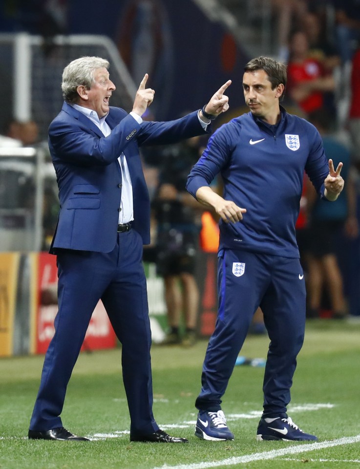 Neville and Roy Hodgson desperately try to get their message across to the England players during the Iceland game