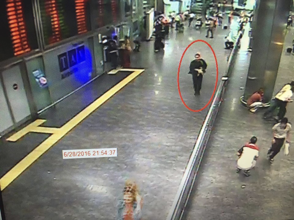  Deadly ... One of the bombers walks through Ataturk airport