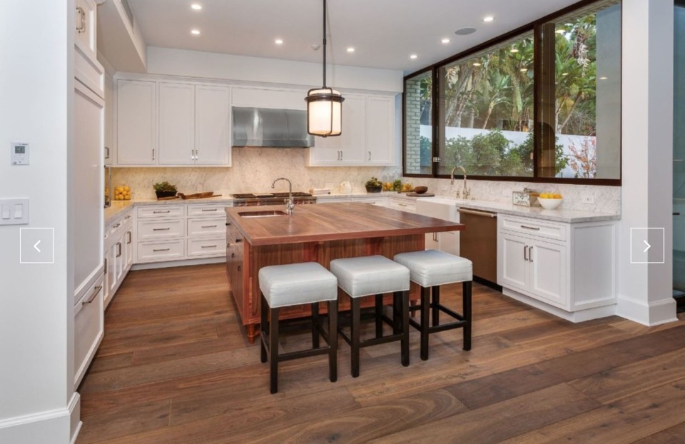  The living space has wooden floors and exposed brick walls