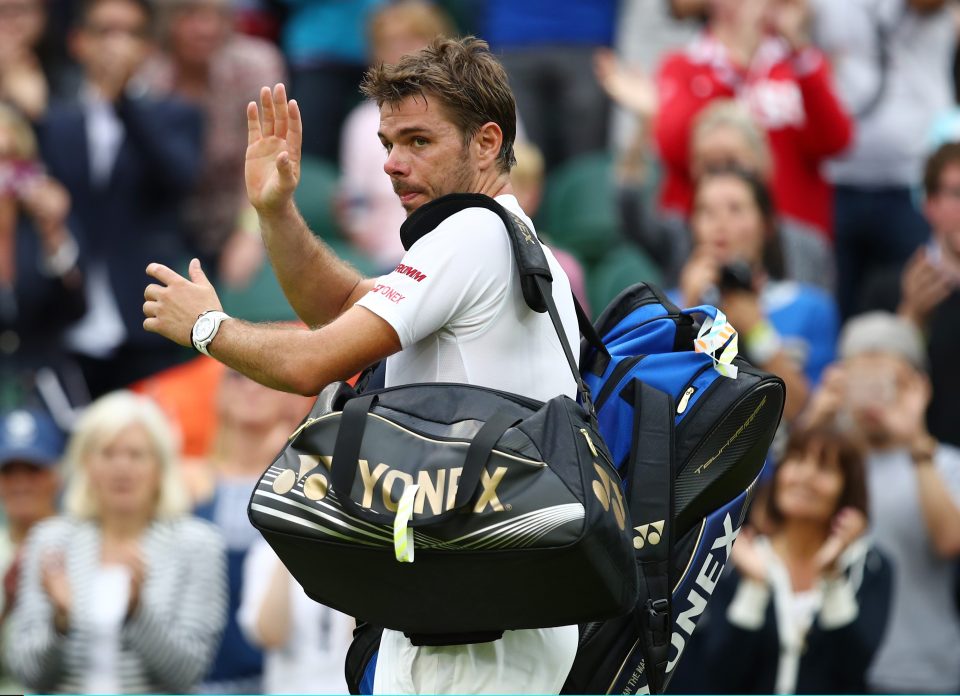  Over and out...beaten Wawrinka applauds his supporters