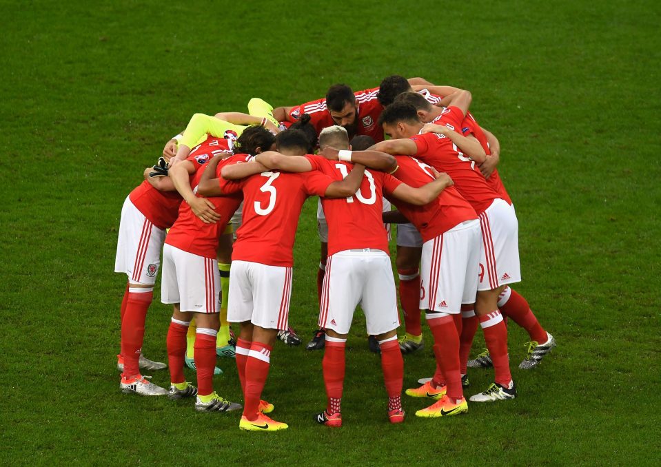  Wales huddle together before the epic quarter-final against Belgium