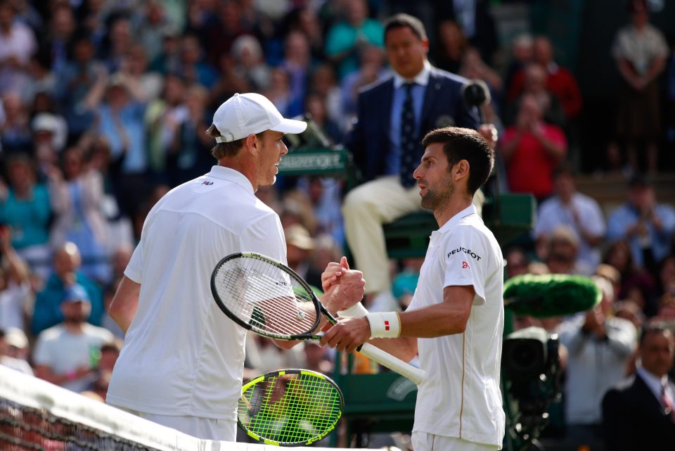  Sam Querrey and Novak Djokovic embrace after the third round tie