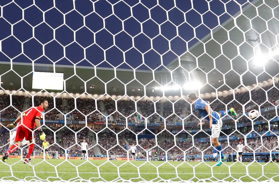 Italy goalkeeper Gianluigi Buffon, left, watches Italy's Alessandro Florenzi, right, deflect a shot from Germany's Thomas Mueller during the Euro 2016 quarterfinal soccer match between Germany and Italy, at the Nouveau Stade in Bordeaux, France, Saturday, July 2, 2016. (AP Photo/Martin Meissner)