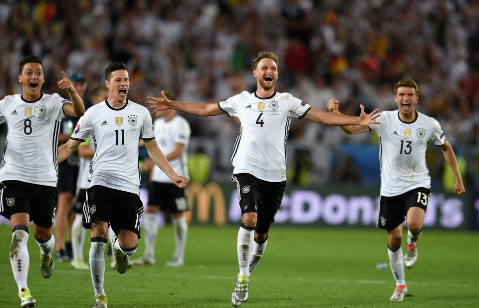 BORDEAUX, FRANCE - JULY 02: Germany players dash to celebrate their win through the penalty shootout after Jonas Hector scores to win the game after the UEFA EURO 2016 quarter final match between Germany and Italy at Stade Matmut Atlantique on July 2, 2016 in Bordeaux, France. (Photo by Claudio Villa/Getty Images)