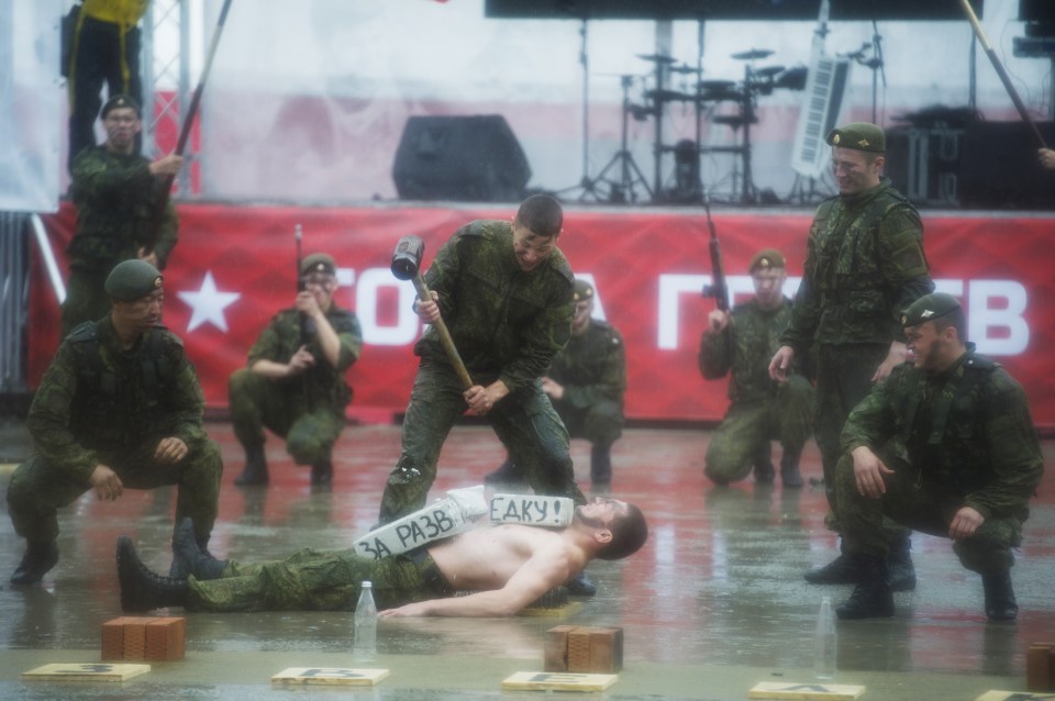 One amazing photo saw a cadet struck with a sledgehammer as part of the event's opening