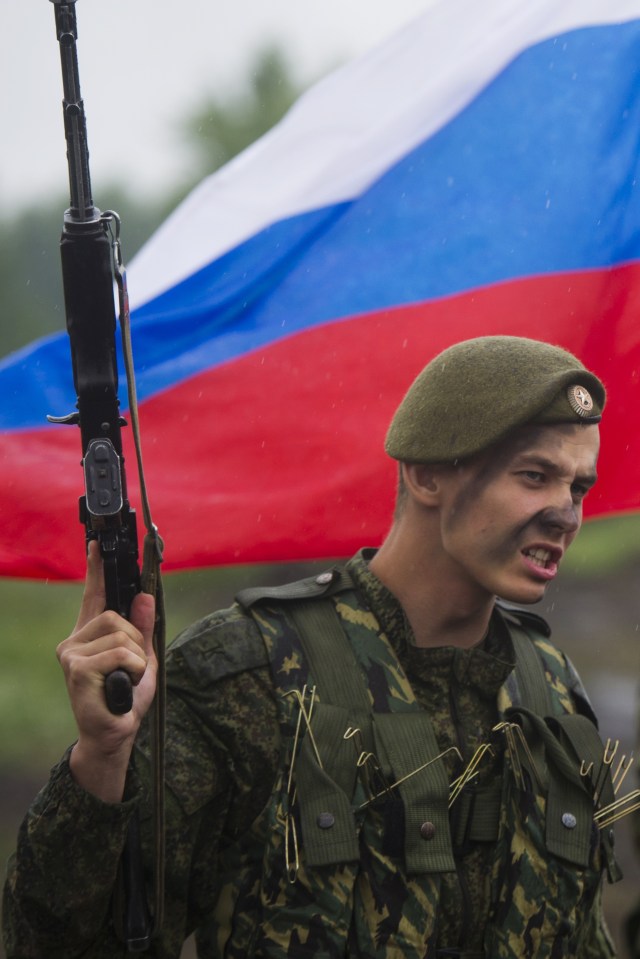 Soldiers waved guns and posed with Russian flags on-site at the patriotic challenge