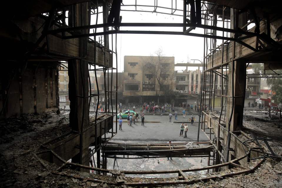  People gather outside the damaged buildings as 35 people are still missing