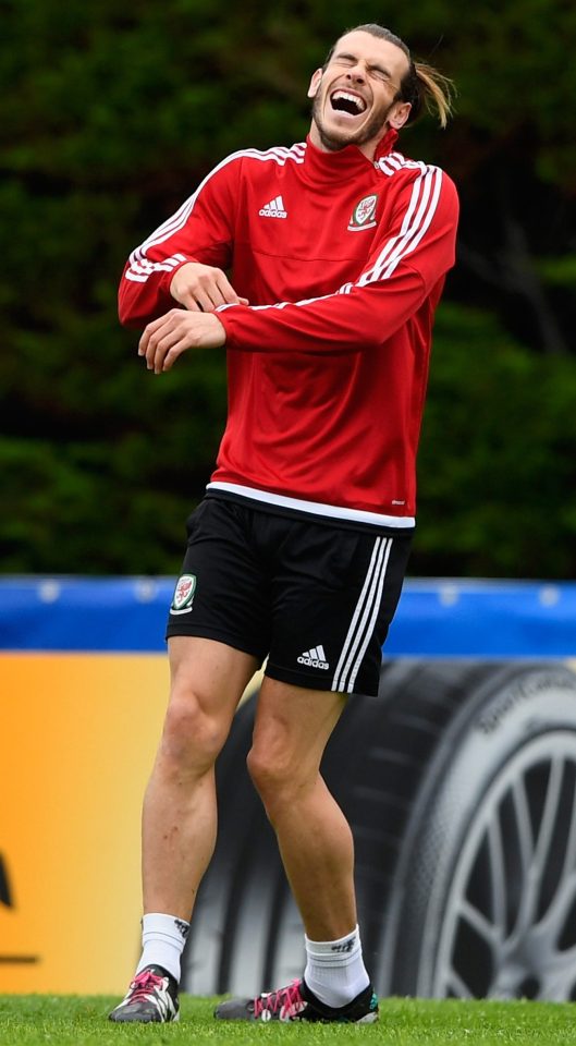  Bale looked in high spirits as he joked with the rest of the squad