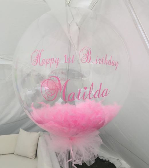  The little girl even had personalised feather balloons