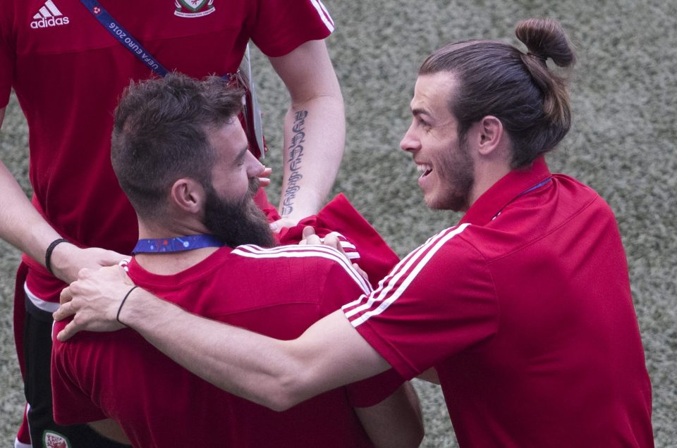  Bale and Ledley share a laugh