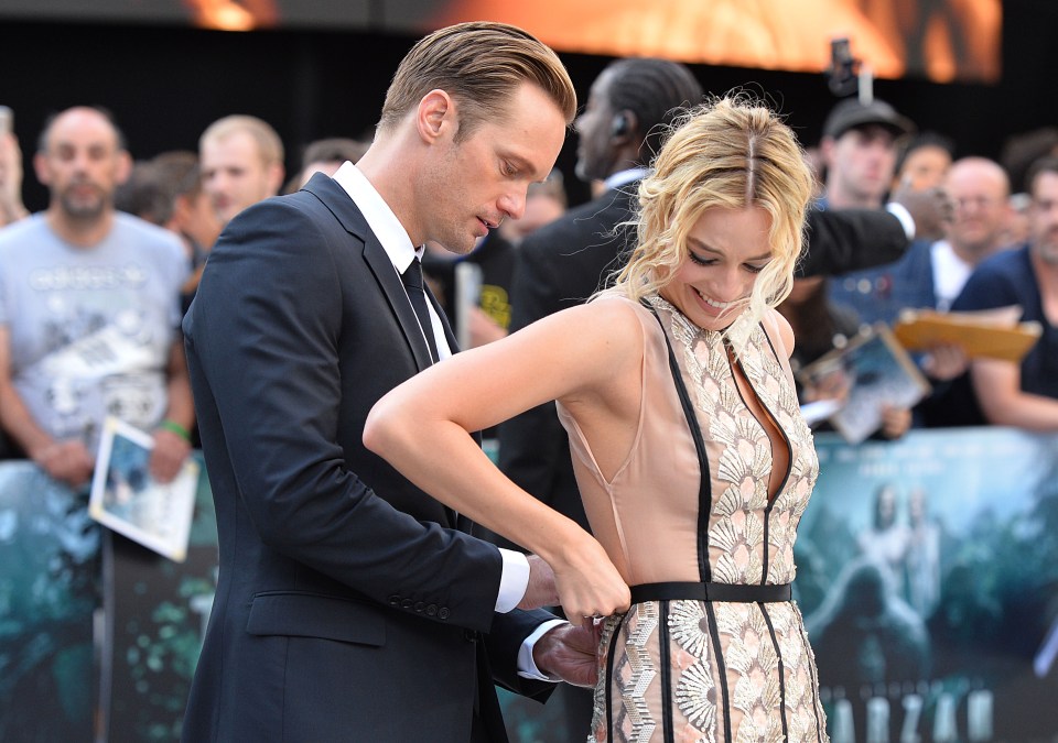  Alexander stepped in to help Margot with her dress