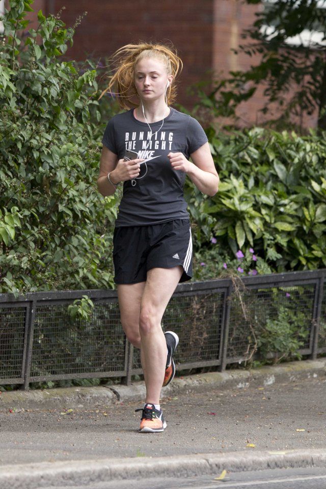  Her trendy trainers had a splash of orange