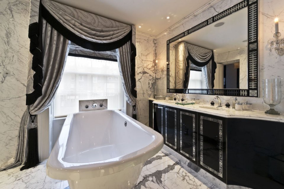 A huge free-standing bath allows residents to bathe with views of the posh streets below