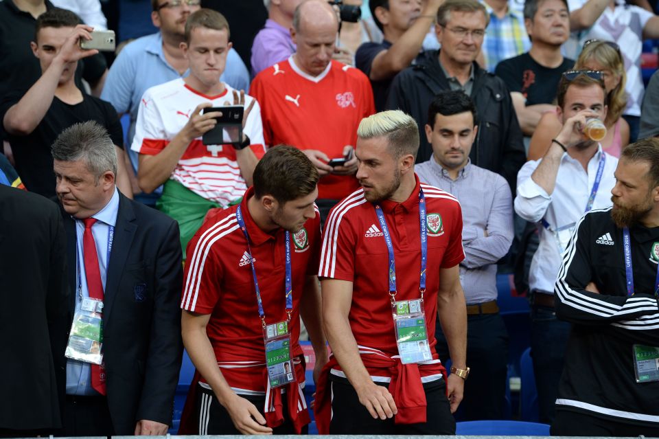  Ben Davies and Aaron Ramsey take their places in the stands while they serve their suspensions for the semi final