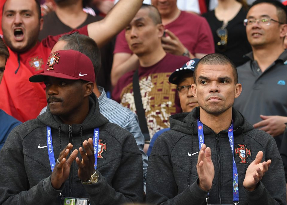  Suspended William Carvahlo and injured Pepe watch on during the opening moments of the game