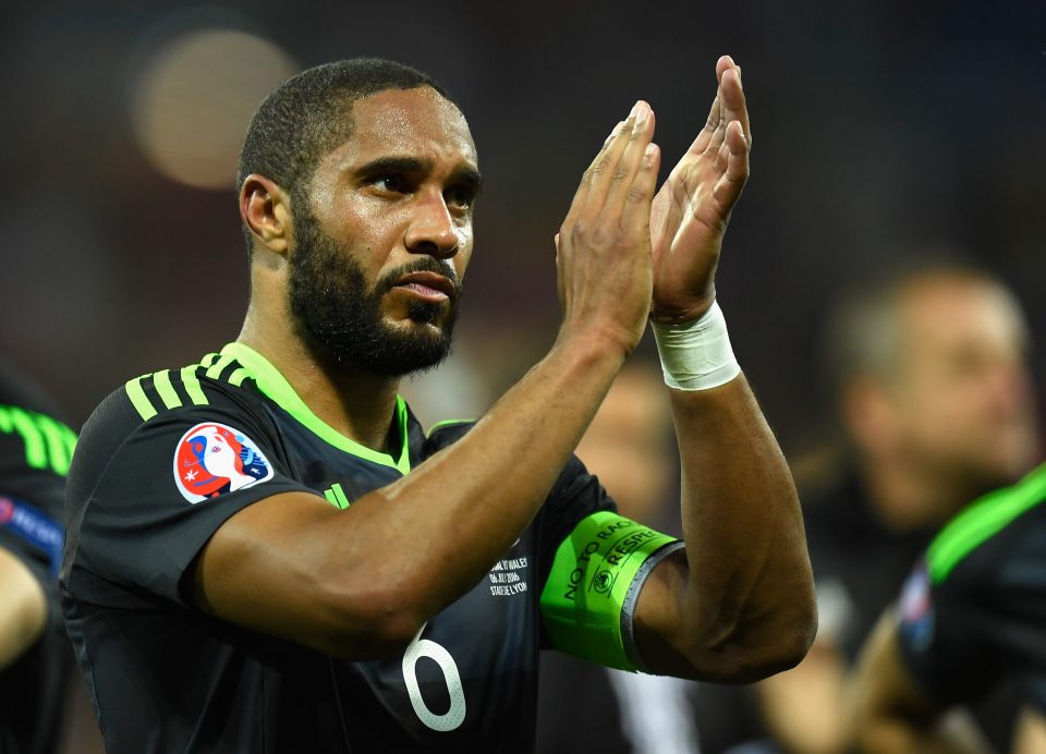 Centre-back Williams applauds the hoards of proud Wales fans in the stands