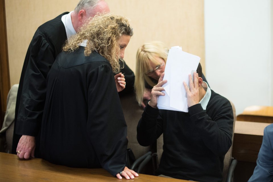 The men tried to cover their faces in the Cologne court where they were found guilty of sexual assault