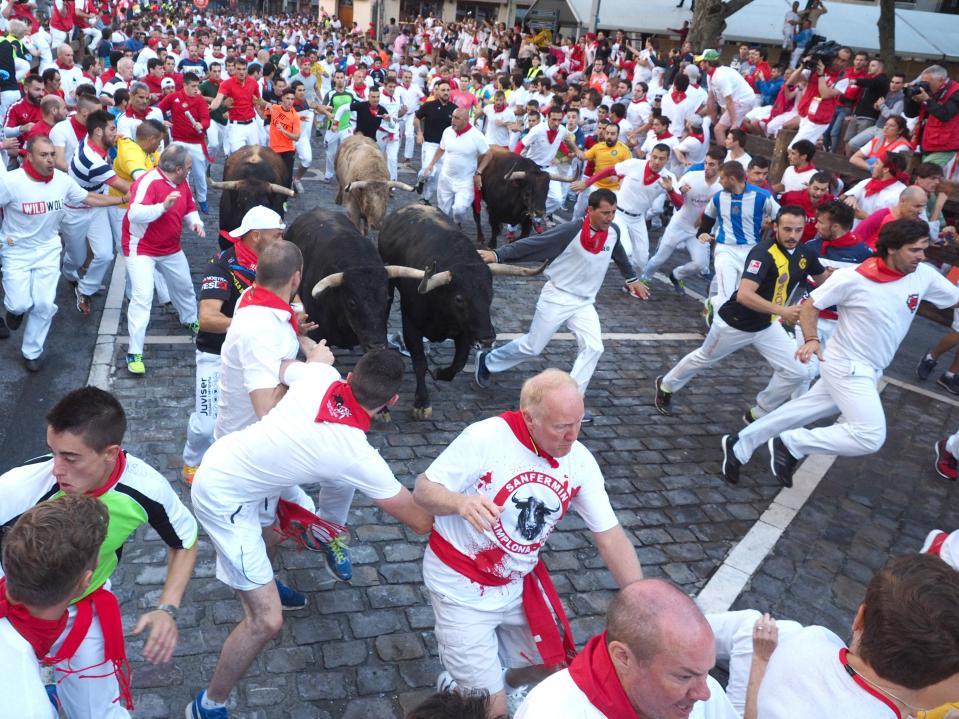  Run for it! Thousands of thrill-seekers head to Pamplona, risking life and limb to run with the bulls