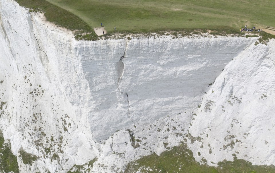  Walkers have been pictured just yards from the crack, oblivious that it is there