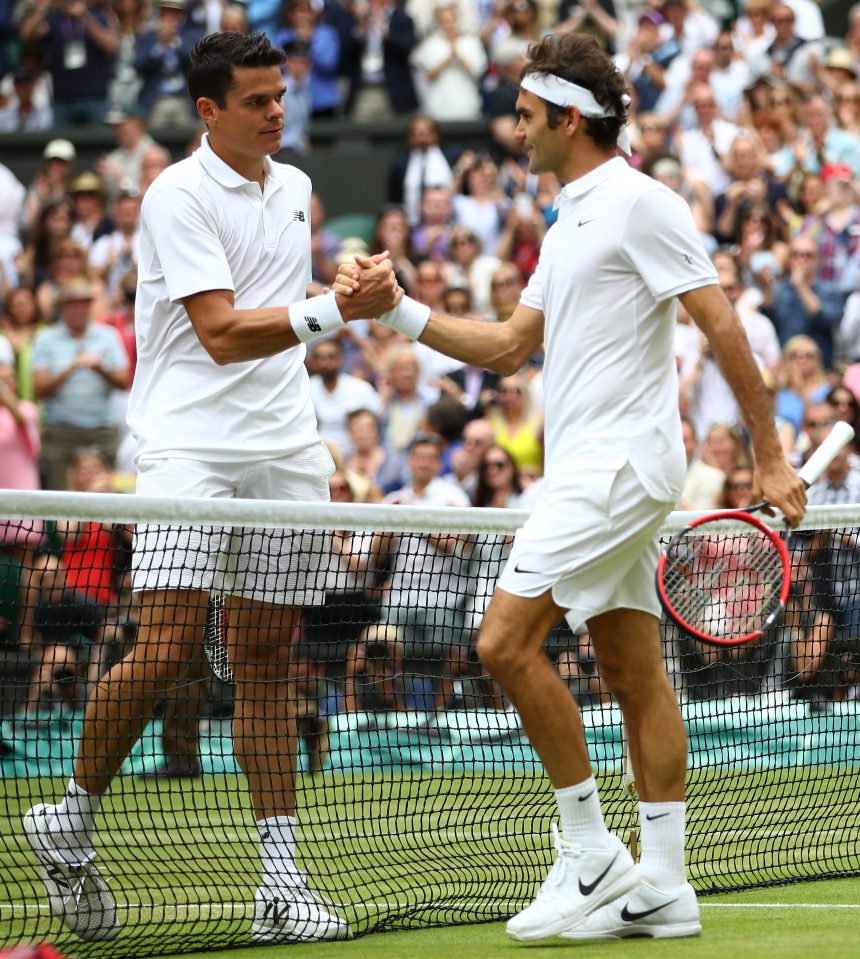  Roger Federer congratulates Milos Raonic after his incredible win