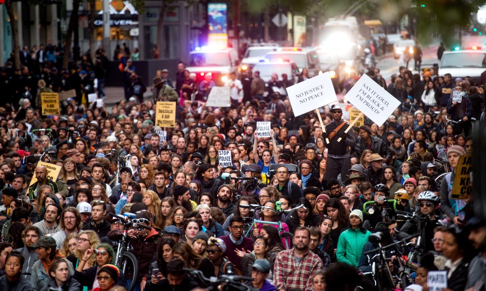 Thousands took to the streets of America to protest over the shooting of two black American men by white police