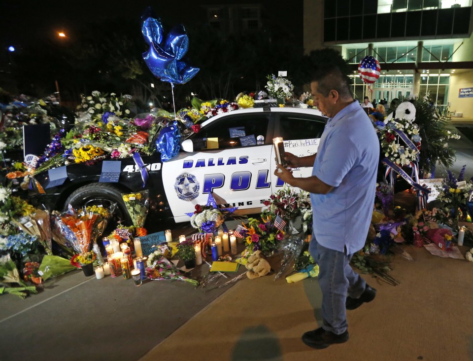 In Dallas vigils broke out as the city came to terms with the murderous shootings that saw 12 police shot and five killed