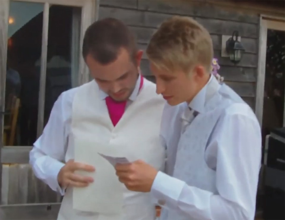  He shows the winning card to the groom