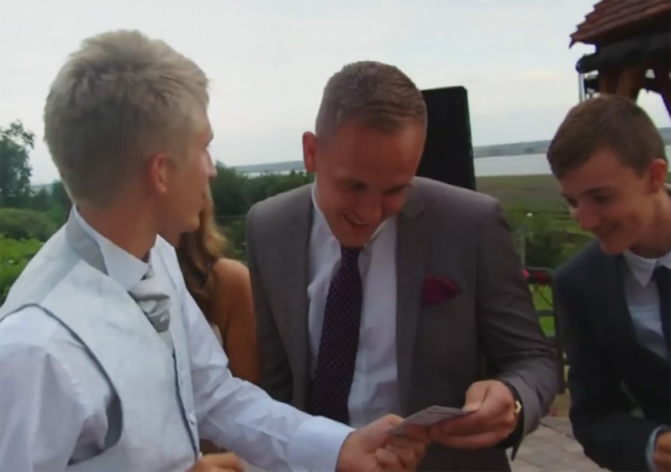  Wesley shows his golden ticket to fellow wedding guests