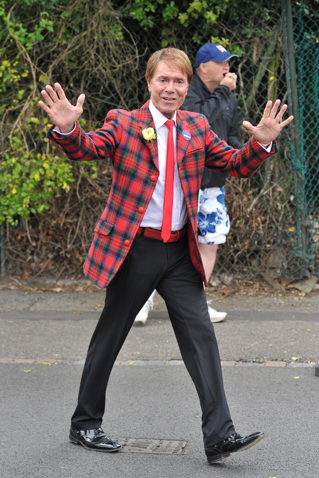  Sir Cliff looked comparatively relaxed as he arrived in his tartan jacket