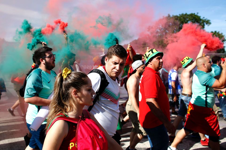 Portugal supporters wave smoke flares as