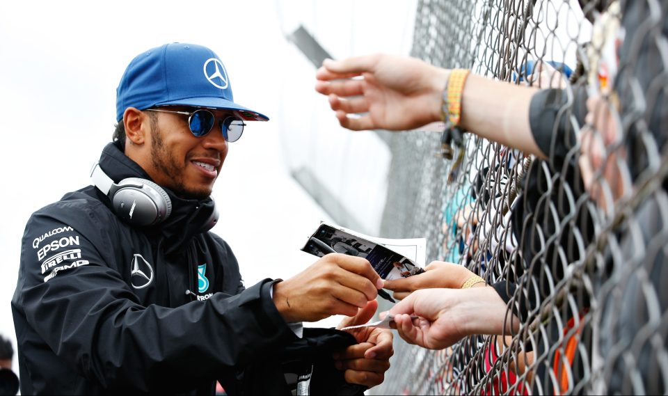 Happy Hamilton signs autographs for fans at Silverstone