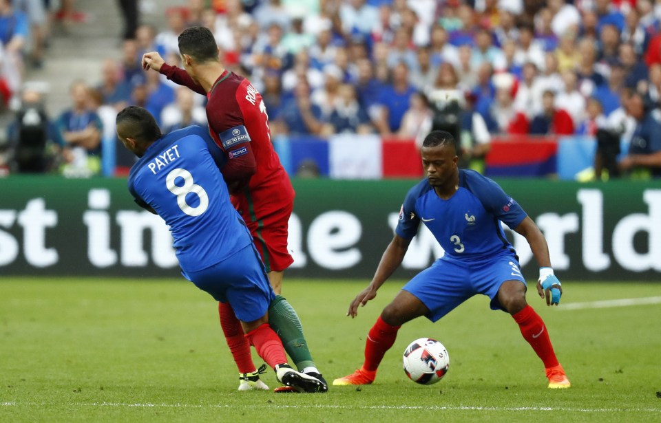 Dimitri Payet's tackle sees his knee collied with Cristiano Ronaldo's