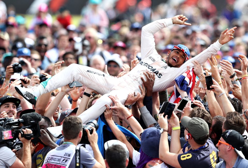 Lewis Hamilton gets a lift form his third British Grand Prix win in a row