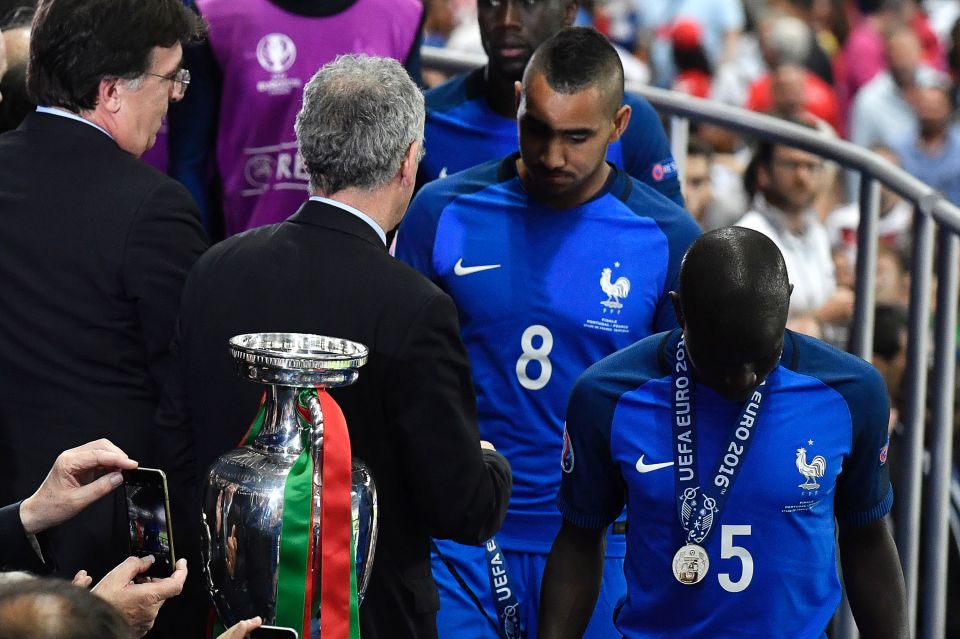 UEFA first vice president Angel Maria Villar (L) presents France's forward Dimitri Payet and France's midfielder N'Golo Kante with medals during the awarding ceremony after the Euro 2016 final football match between Portugal and France at the Stade de France in Saint-Denis, north of Paris, on July 10, 2016. / AFP PHOTO / PHILIPPE LOPEZPHILIPPE LOPEZ/AFP/Getty Images