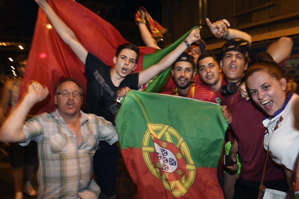  Portugal fans waved flags to celebrate the victory as they watched the game in red and green