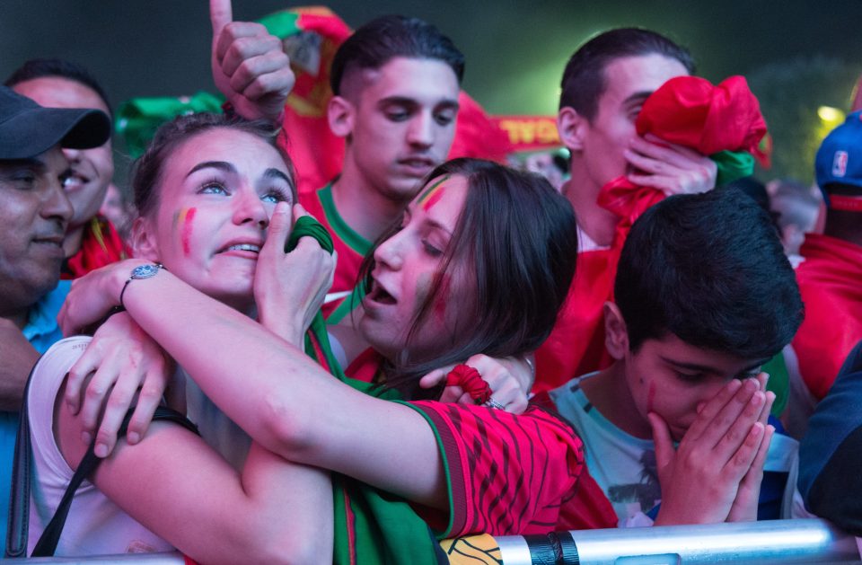  Portuguese fans react to their extra time win in fan zones in Paris