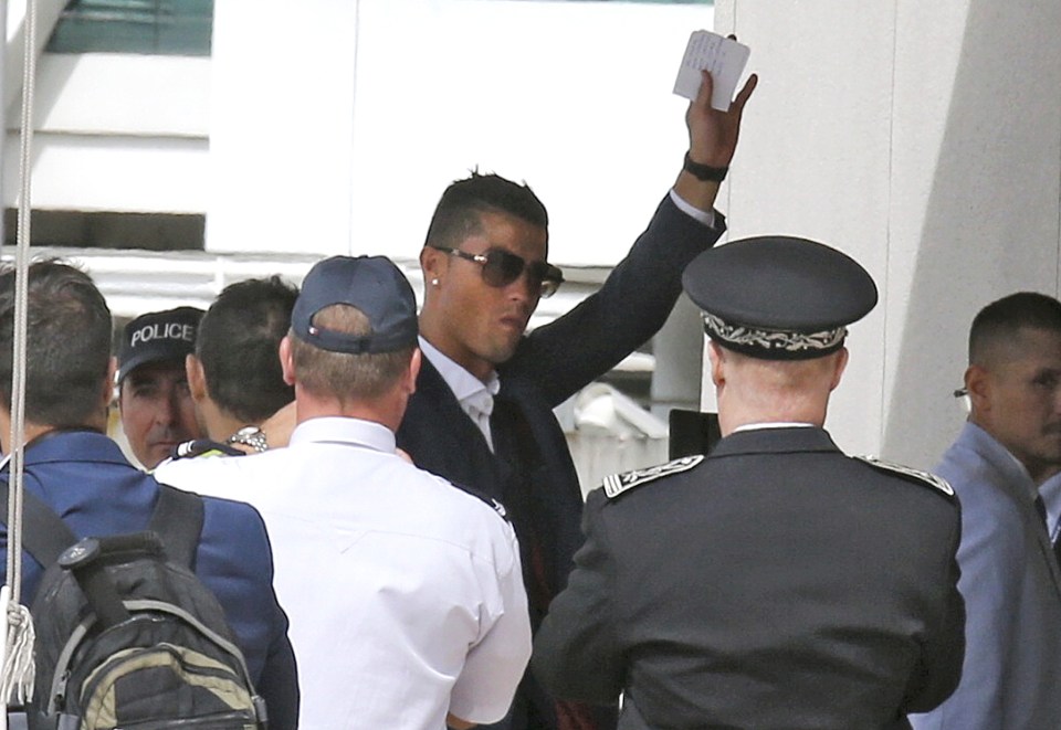  Star man Cristiano Ronaldo waves at fans the squad leave France